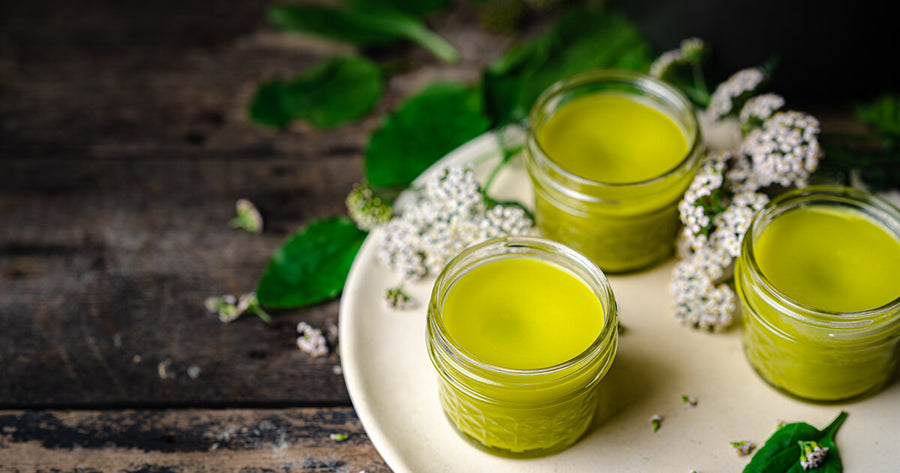 Herbal Balm in Jars on wood table