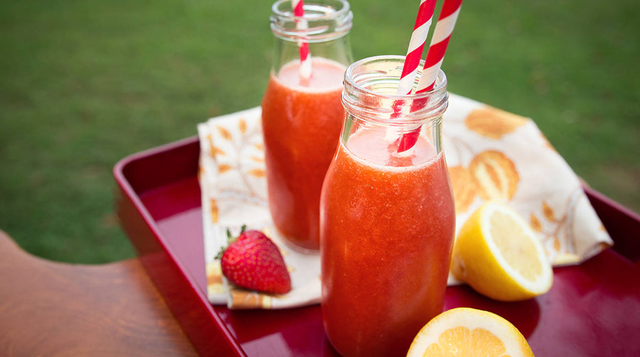 Berry Mint Lemonade on tray with fruit