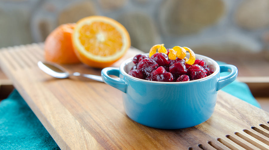 Cran-Elderberry relish in jar with oranges in back