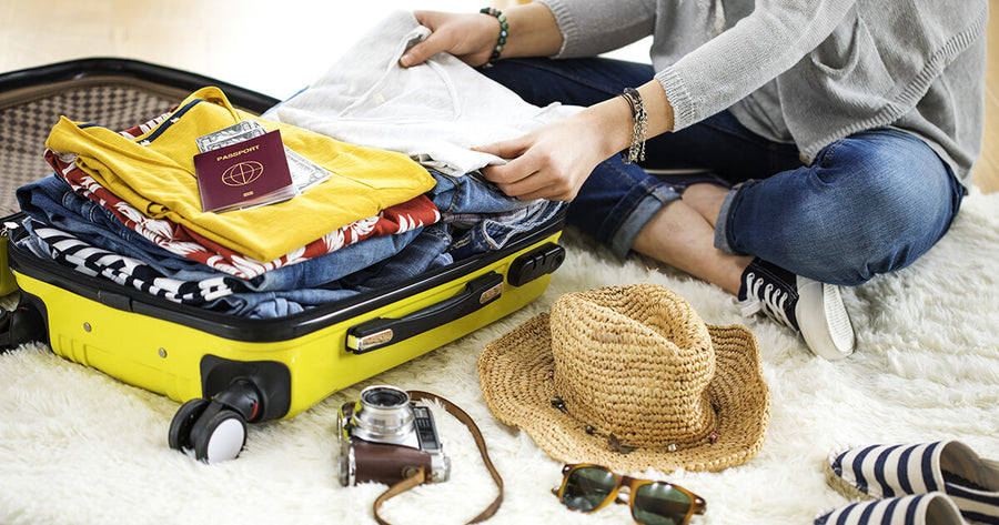 Woman packing suitcase