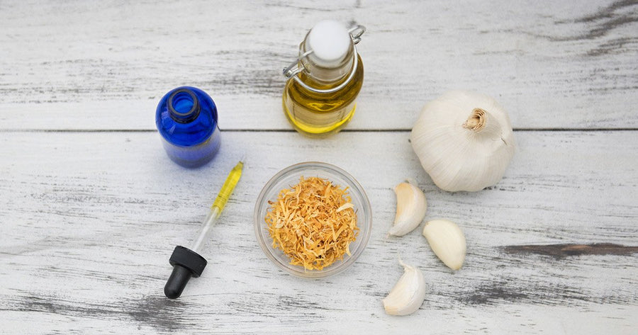 Garlic, oil and herbs for DIY ear drops