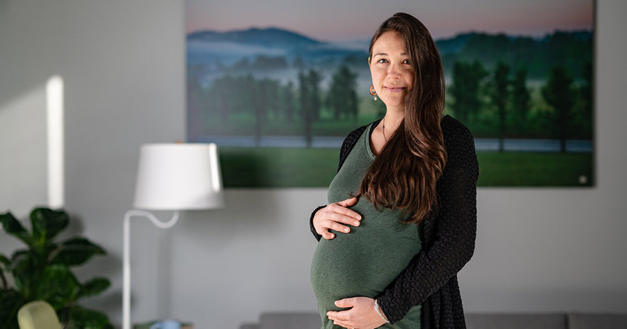 Pregnant woman holding belly