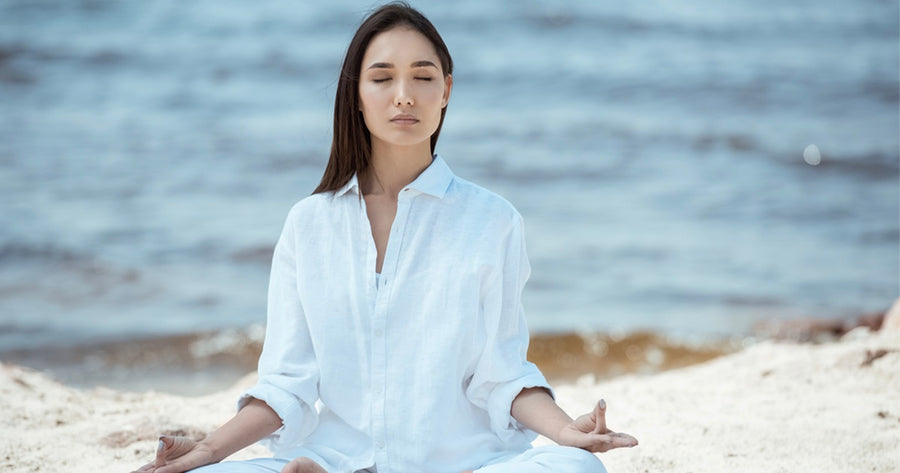 Woman learning how to calm down by doing yoga